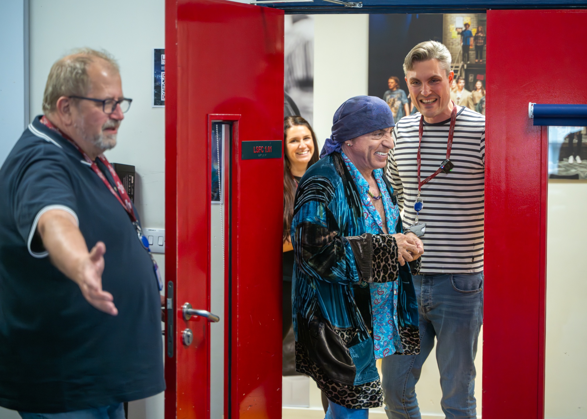 Steve enters the classroom for his talk.