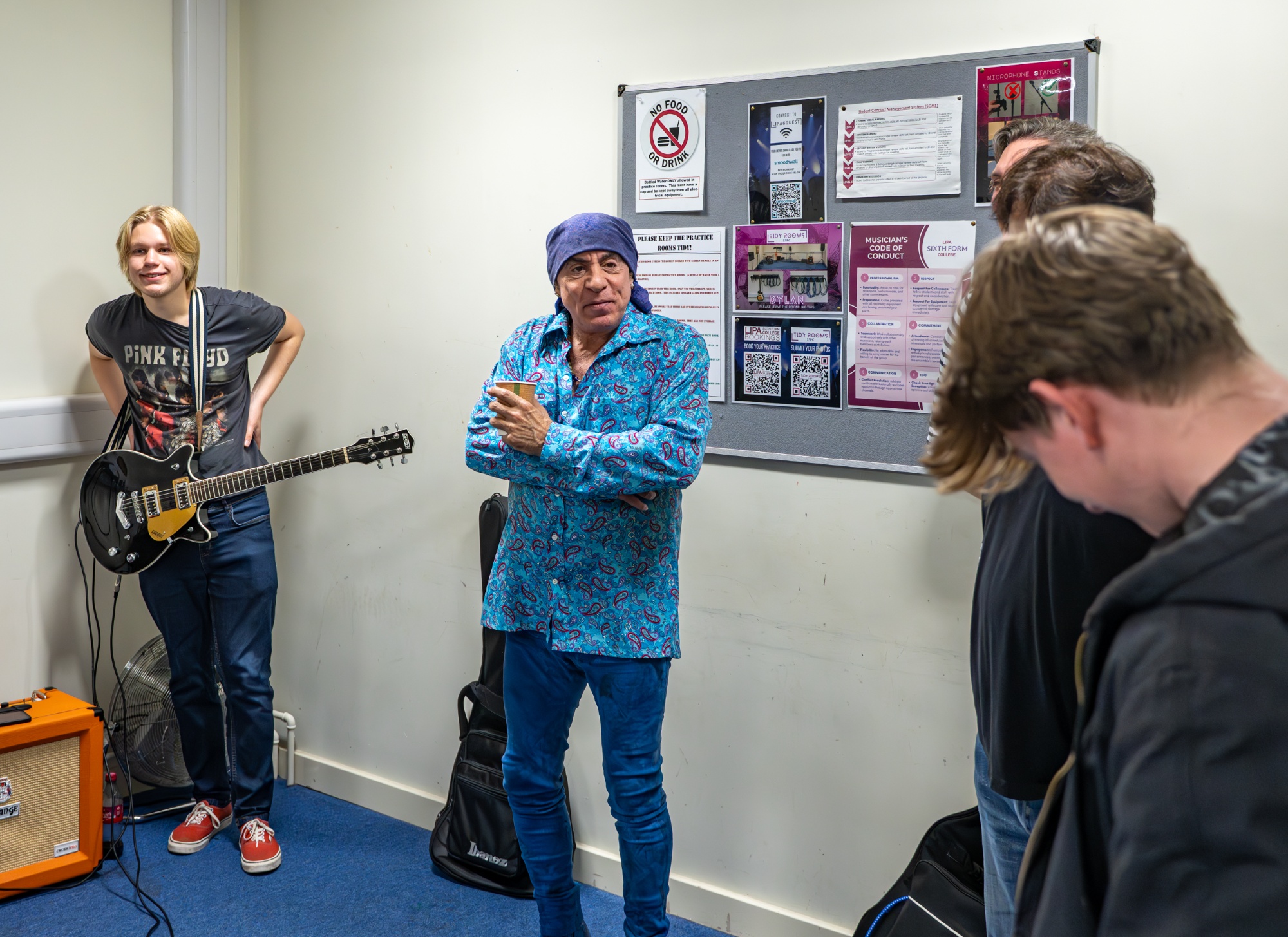 Steve joins students in the practice rooms.