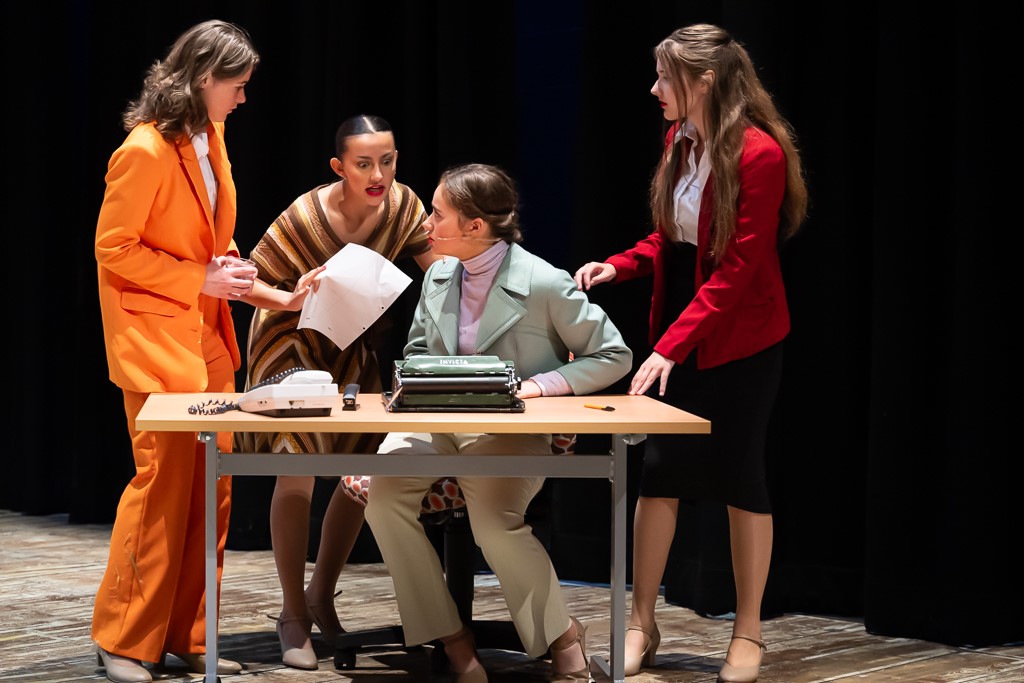 Rosa acting with three other students on stage