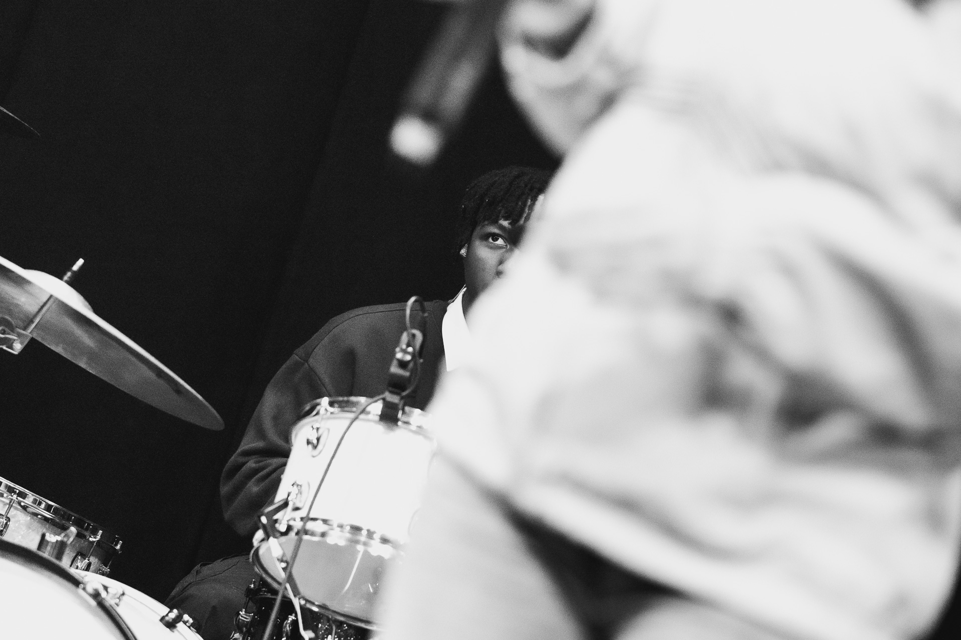 A student playing the drums.